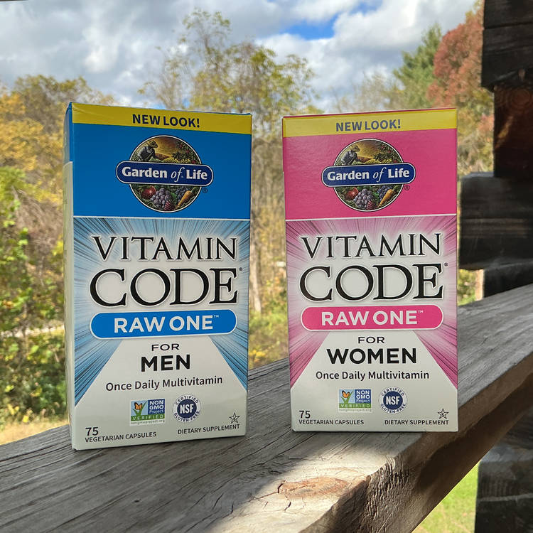 Two Garden of Life Vitamin Code Raw One boxes on a wooden surface with a natural background.