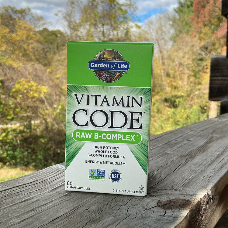 Garden of Life Vitamin Code Raw B-Complex supplement box on a wooden surface with a natural background