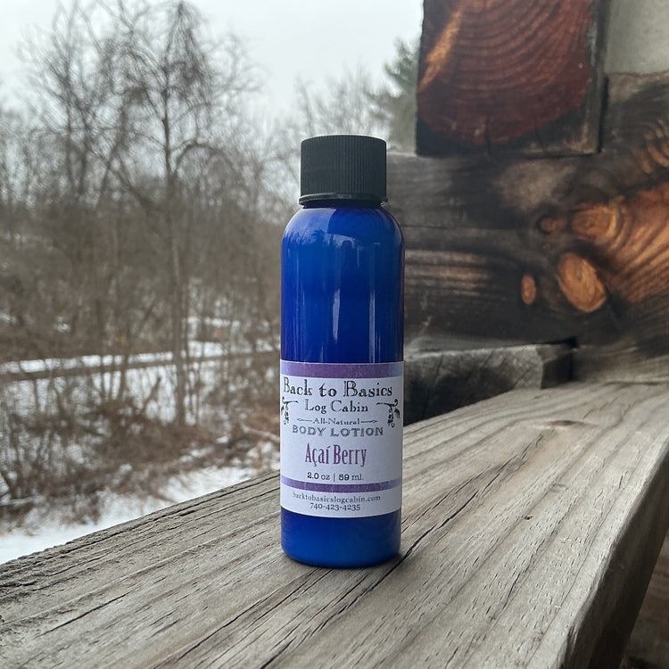 Blue bottle of body lotion on a wooden surface with a snowy landscape in the background