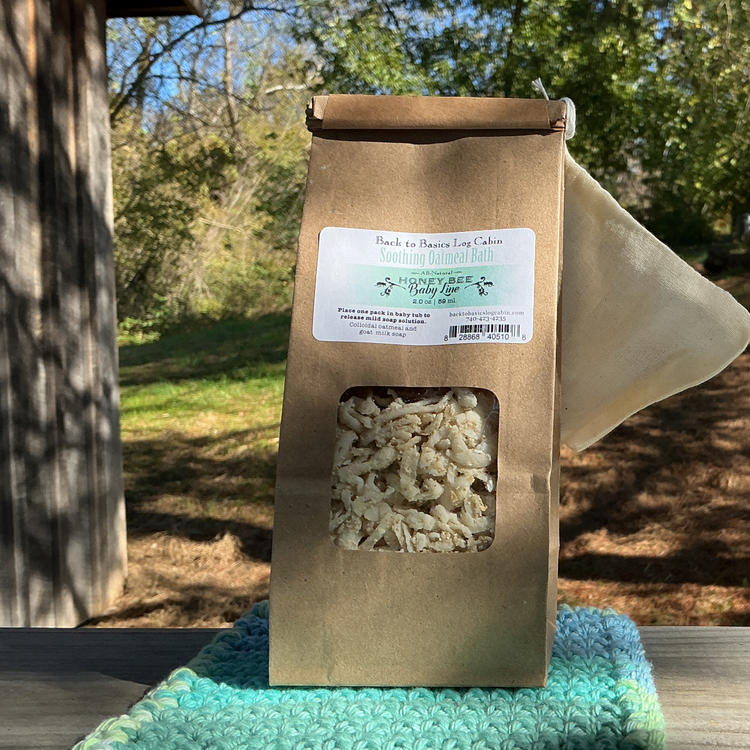 Brown paper package with a window on a green towel outdoors