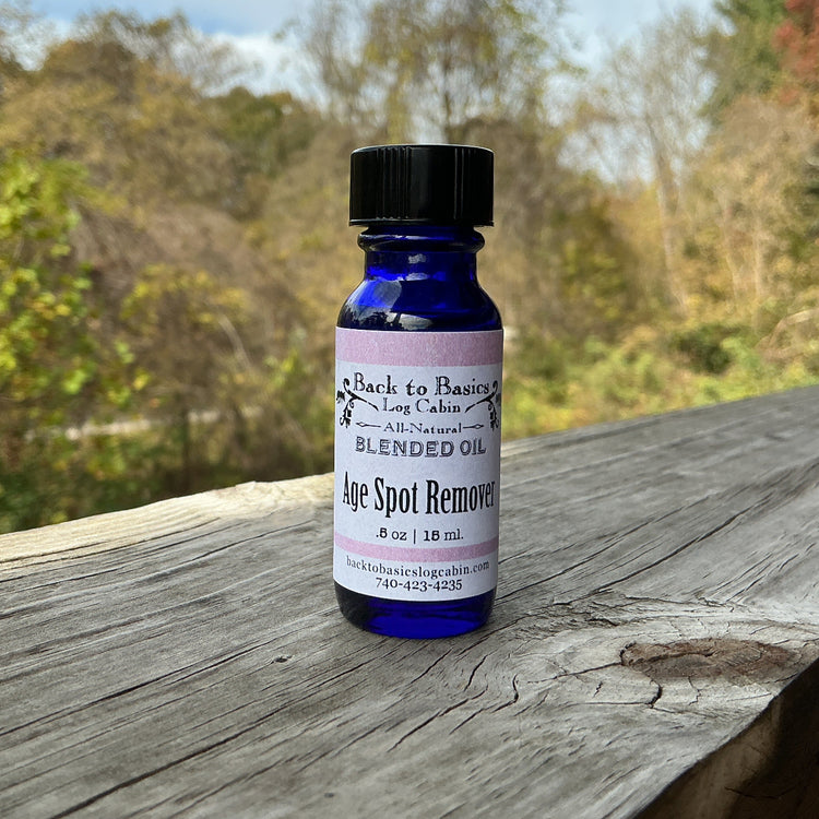 Bottle of age spot remover on a wooden surface with a natural background