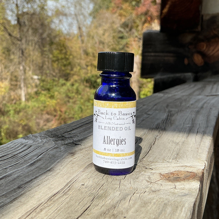 Bottle of Allergies Blended Oil on a wooden surface with a natural background