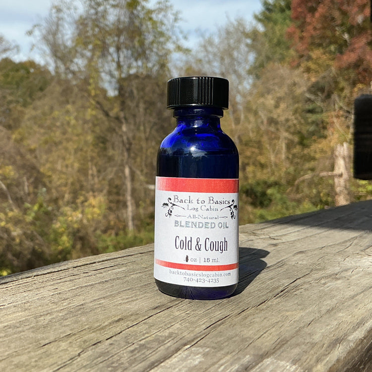 Bottle of cold and cough syrup on a wooden surface with trees in the background