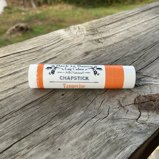 Chapstick tube on a wooden surface with 'Back to Basics' branding.