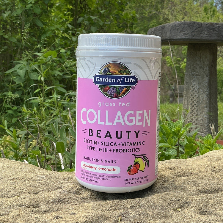 Garden of Life collagen supplement container on a rock with a natural background