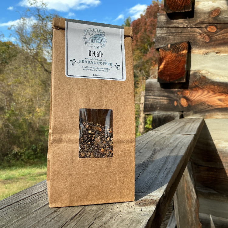 De'cole Herbal Coffee package on a wooden surface with a rustic background