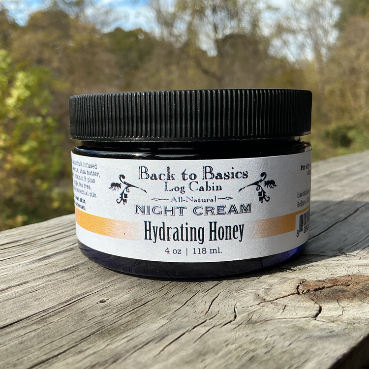 Jar of 'Back to Basics Log Cabin' night cream on a wooden surface with a natural background