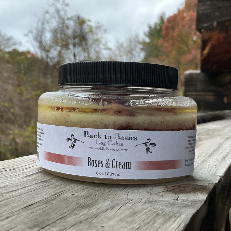 Jar of 'Roses & Cream' on a wooden surface with a natural background