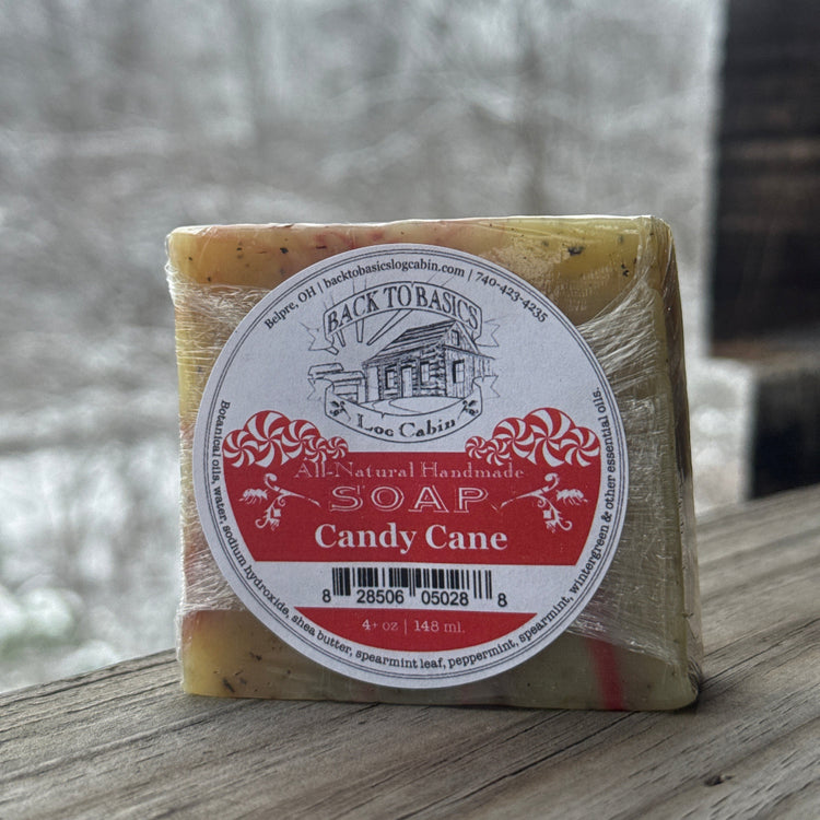 Bar of soap with a label on a wooden surface