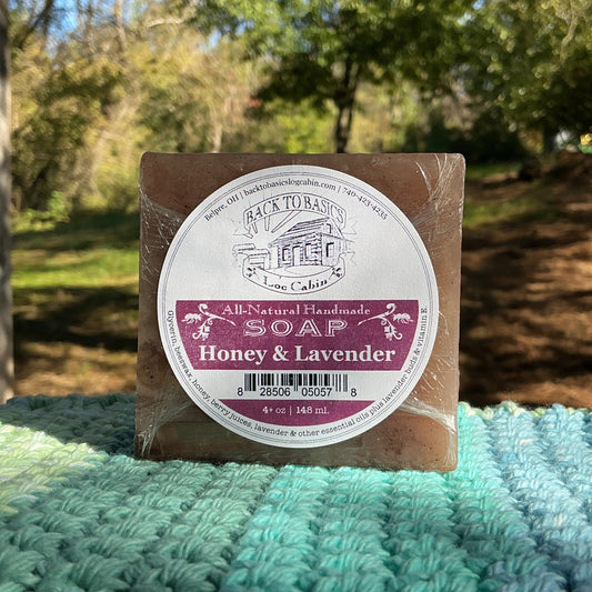 Bar of soap with a label on a textured surface outdoors