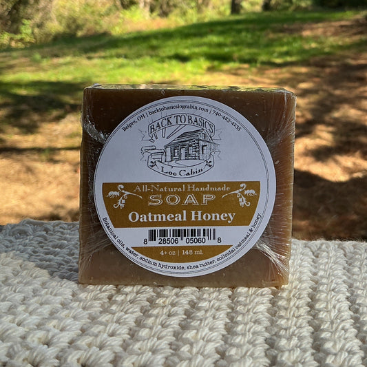 Bar of soap with a label on a textured surface outdoors