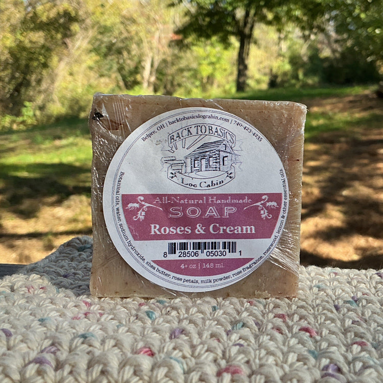 Bar of soap with a label on a textured surface outdoors