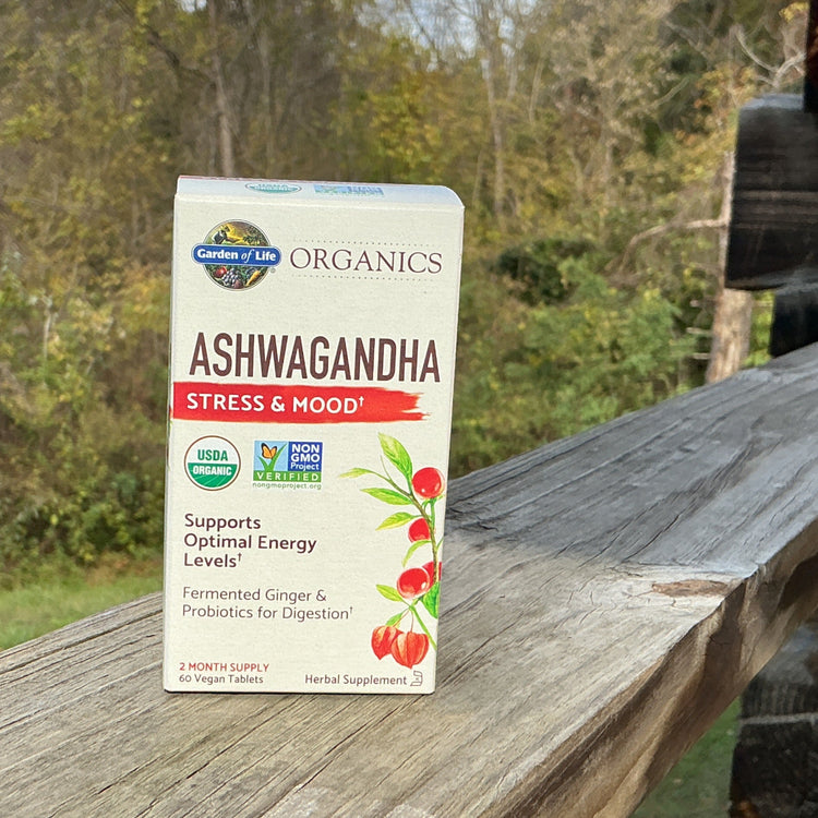 Box of Garden of Life Organics Ashwagandha supplement on a wooden surface with a natural background