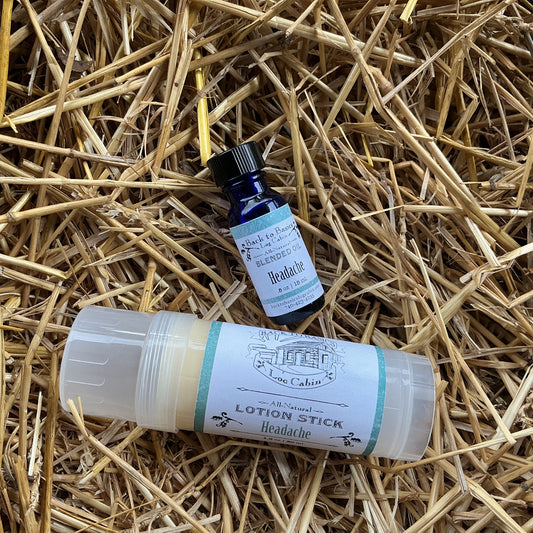 Lotion stick and small bottle on a bed of straw