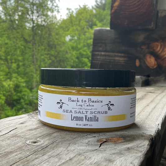 Jar of sea salt scrub with a label on a wooden surface outdoors