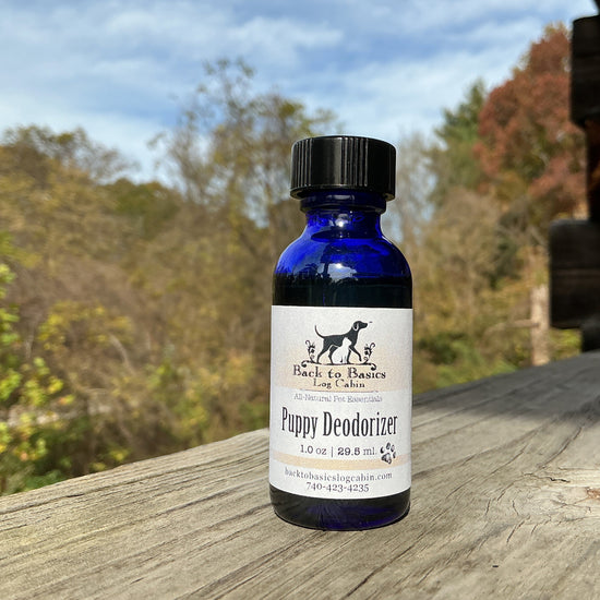 Bottle of Puppy Deodorizer on a wooden surface with a natural background