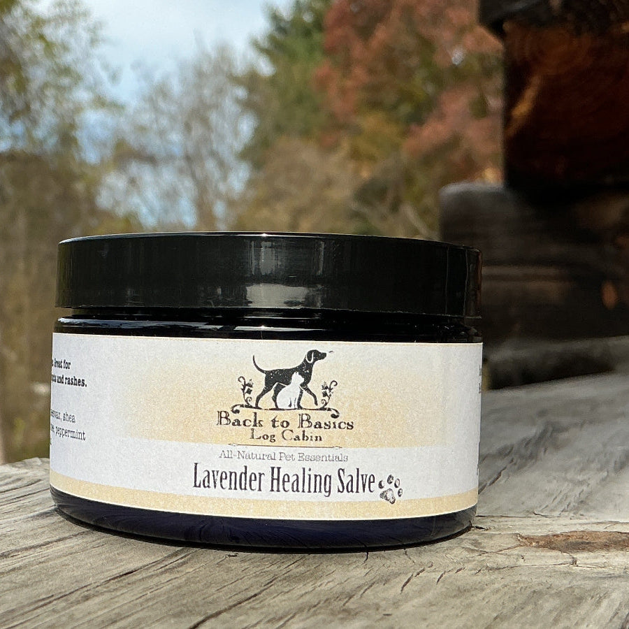 Jar of lavender healing salve on a wooden surface with a natural background