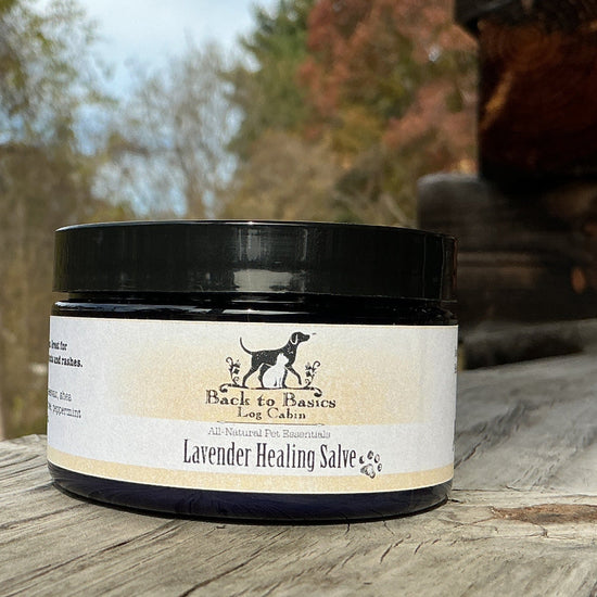 Jar of lavender healing salve on a wooden surface with a natural background