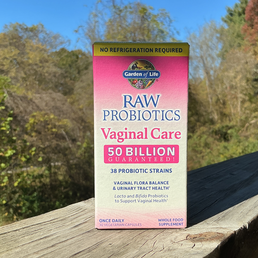 Box of Dr. Formulated Probiotics Vaginal Care on a wooden surface with a blurred natural background