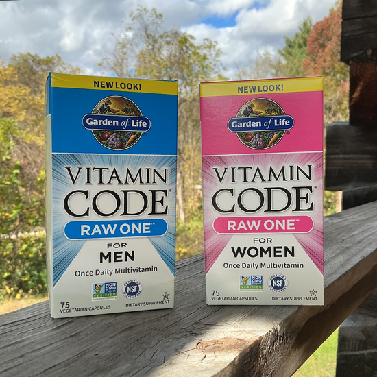 Two Garden of Life Vitamin Code Raw One boxes on a wooden surface with a natural background.
