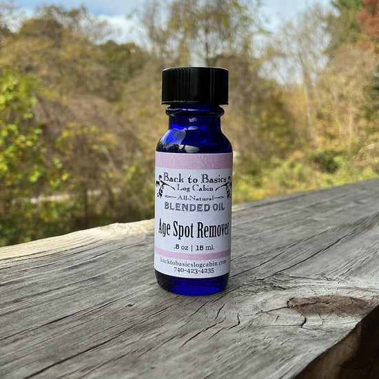 Bottle of age spot remover on a wooden surface with a natural background