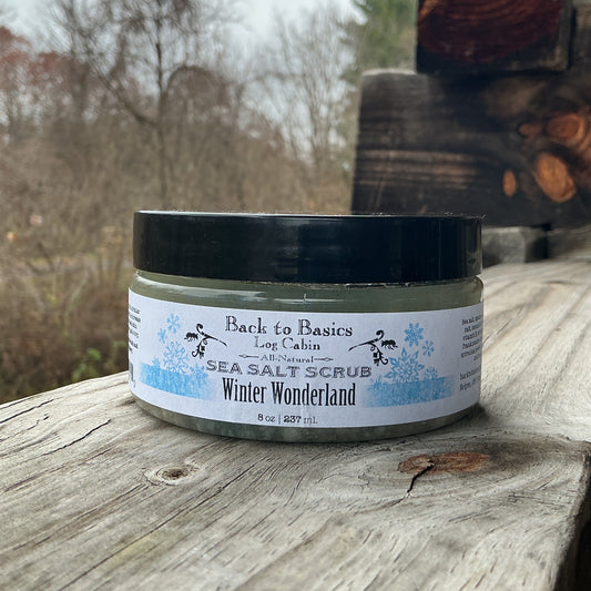 Jar of Back to Basics Sea Salt Scrub on a wooden surface with a blurred natural background