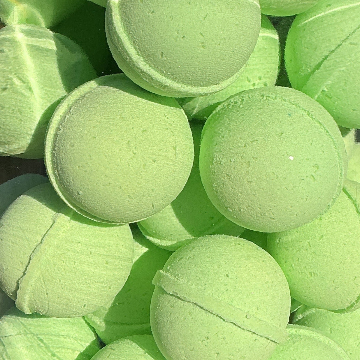 Jar filled with green tennis balls outdoors