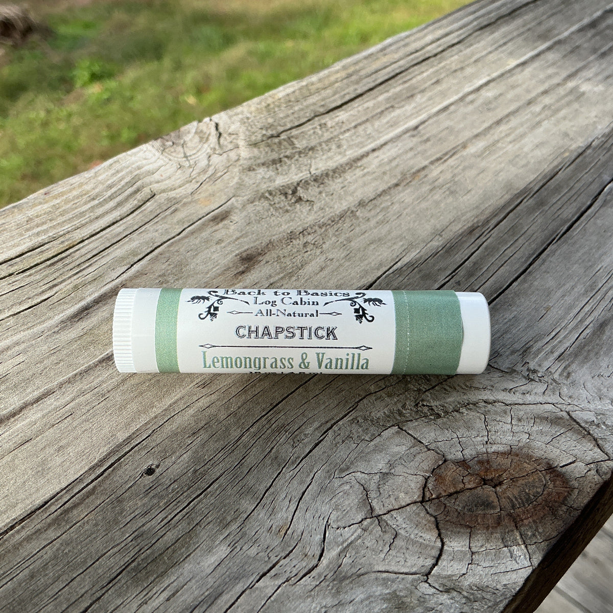 Chapstick with a label on a wooden surface