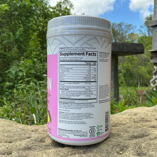 Supplement container with label on a rock outdoors