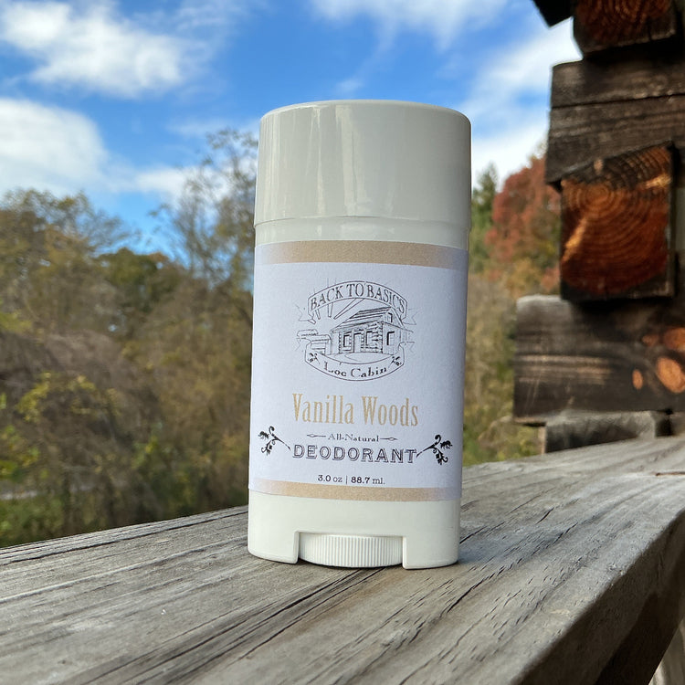 Deodorant stick with a label on a wooden surface outdoors