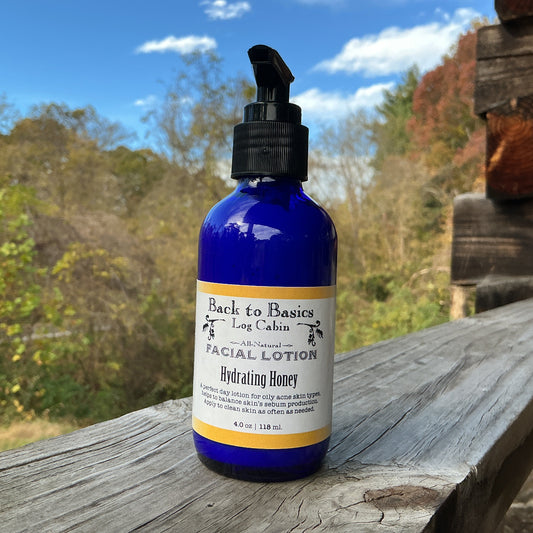 Facial lotion bottle labeled 'Back to the Log Cabin' on a wooden surface with a natural background