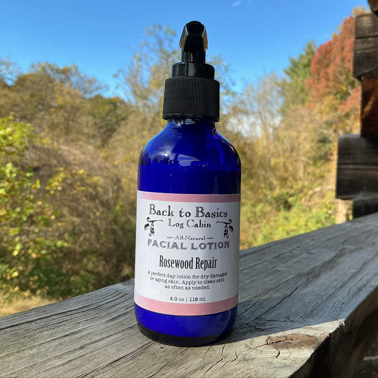 Facial lotion bottle labeled 'Back to Basics' on a wooden surface with a natural background