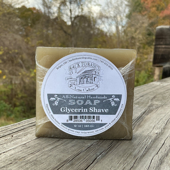 Bar of soap with a label on a wooden surface outdoors