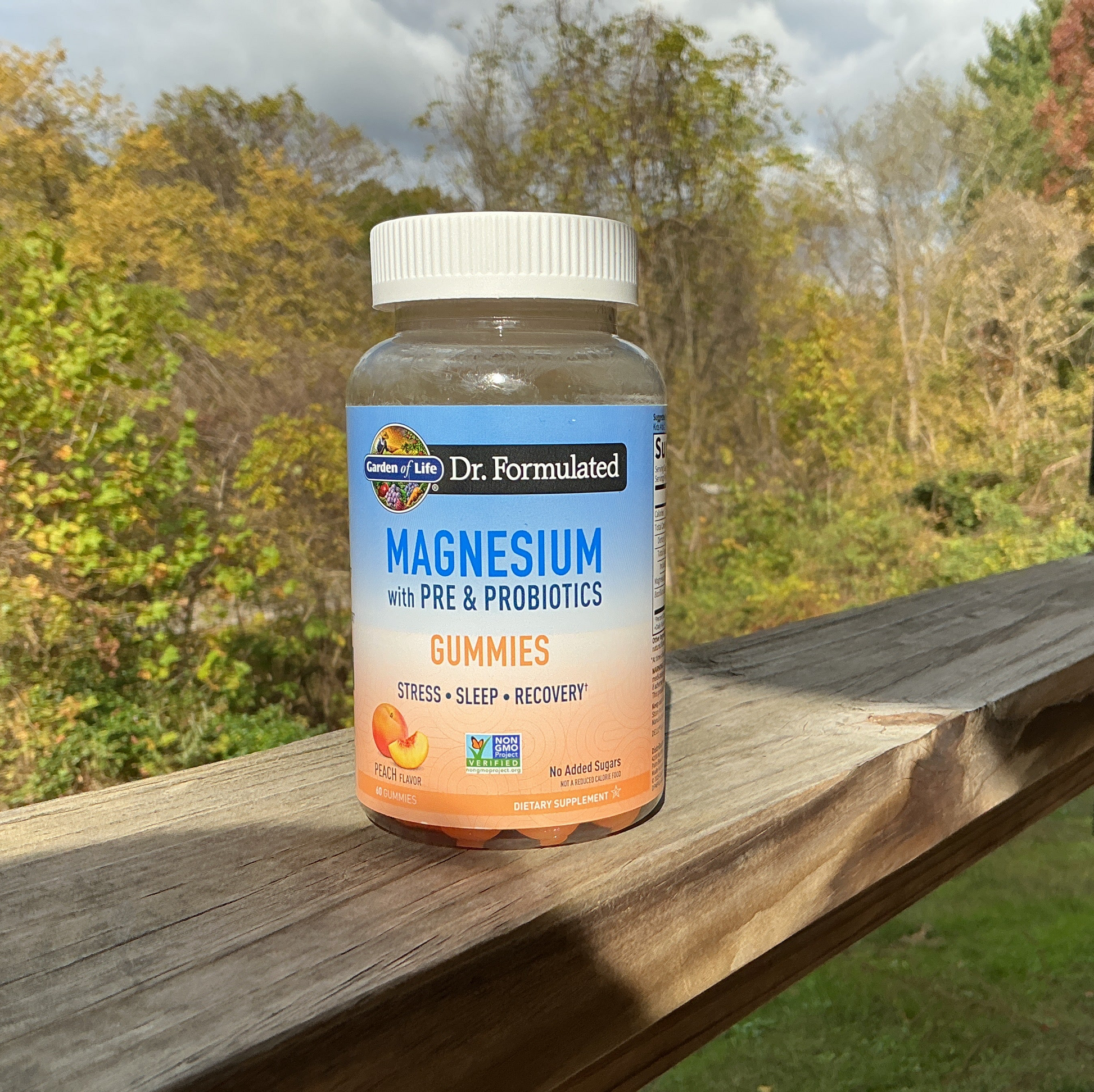 Bottle of magnesium gummies with a natural background