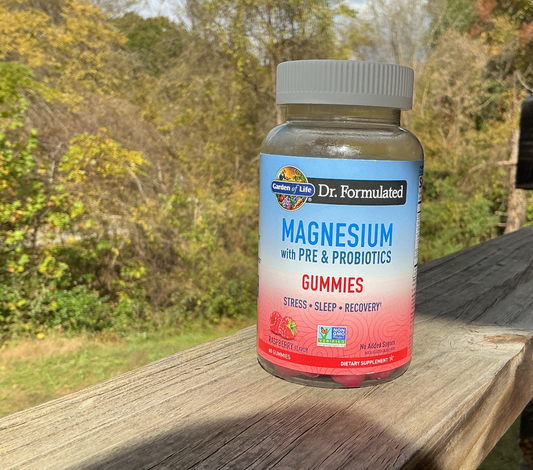 Bottle of magnesium gummies with a natural background