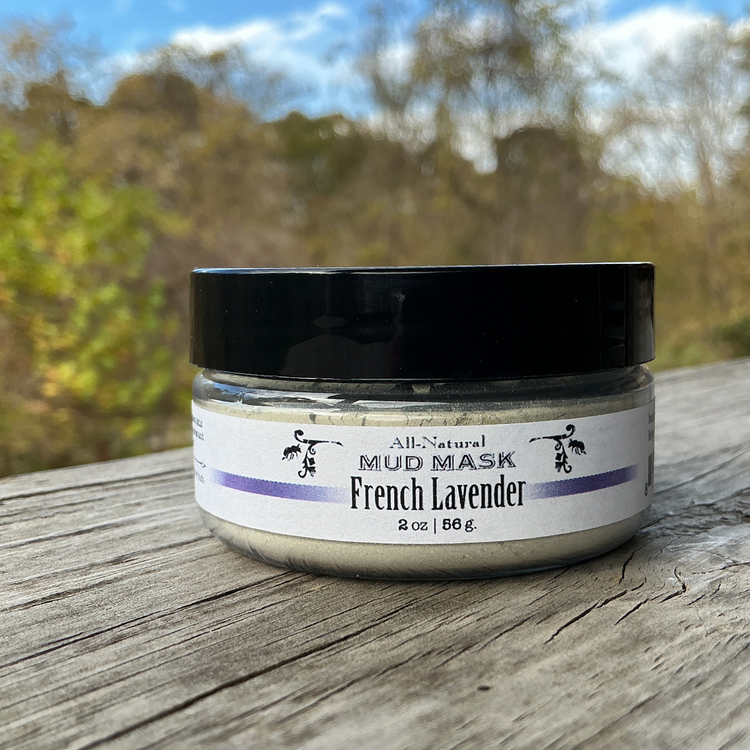 Jar of French Lavender mud mask on a wooden surface with a natural background