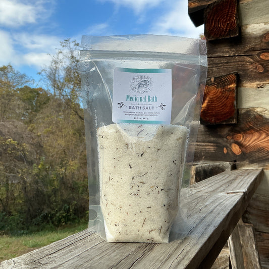 Bag of bath salts on a wooden surface with a natural background