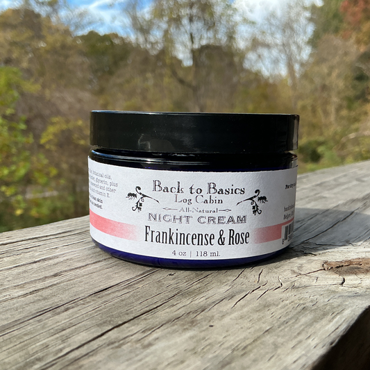 Jar of night cream labeled 'Back to Basics' on a wooden surface with a natural background