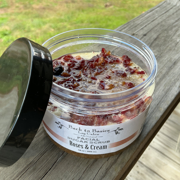 Jar of scrub with visible ingredients on a wooden surface