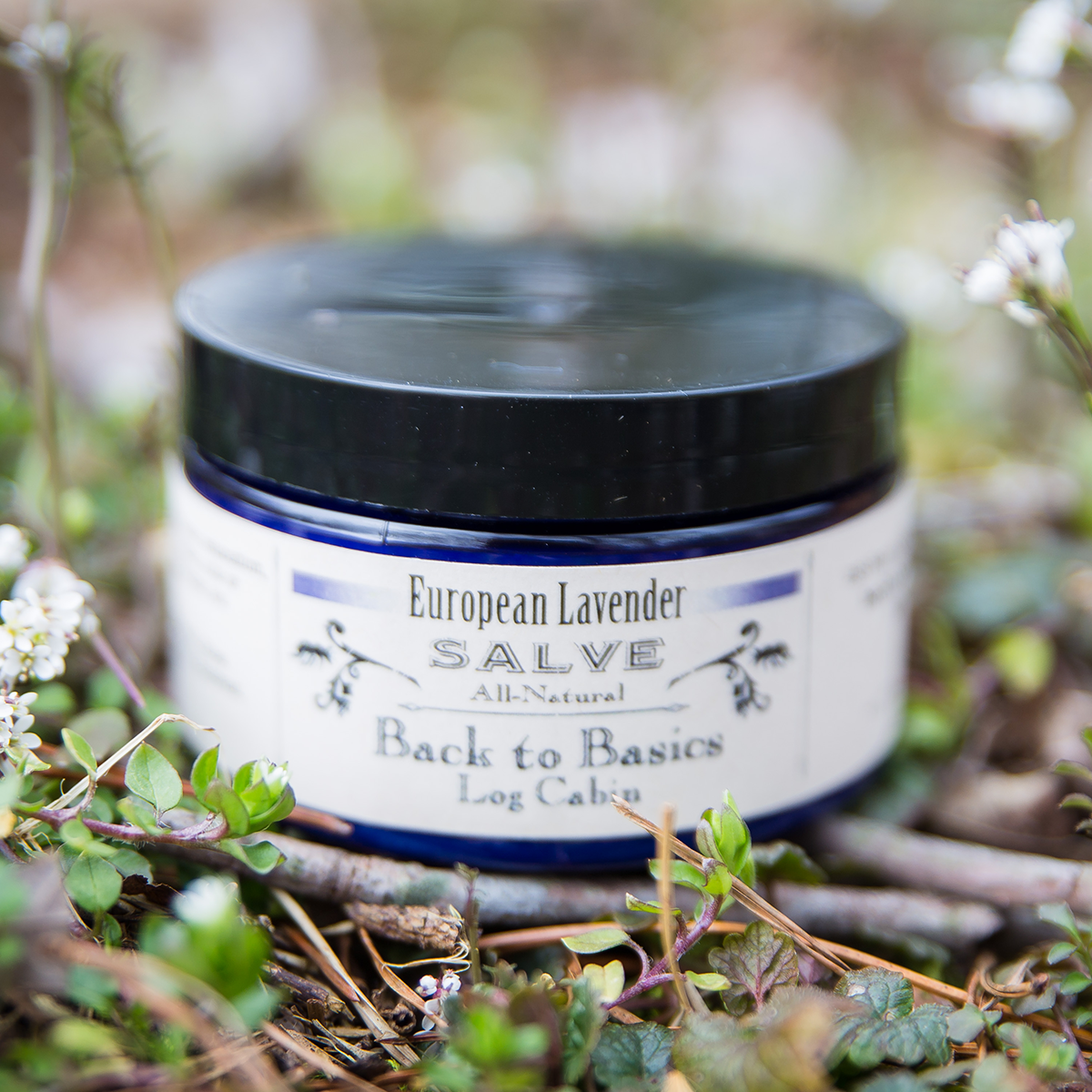 Jar of European Lavender Salve from Back to Basics in a natural setting