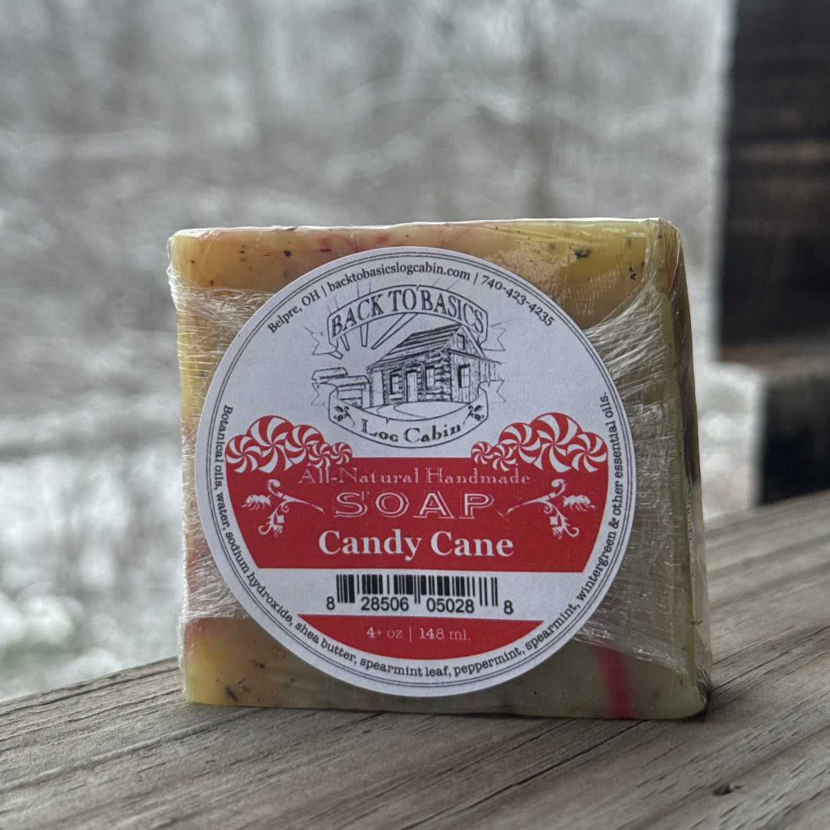 Bar of soap with a label on a wooden surface