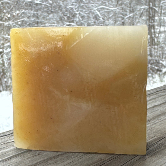 Square bar of soap on a textured surface