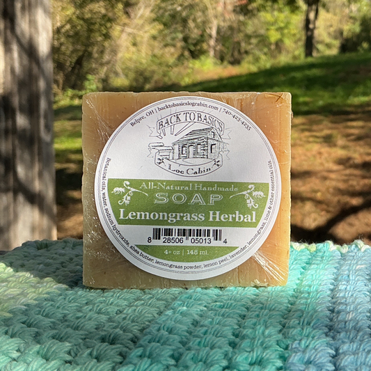 Bar of soap with a label on a textured surface outdoors