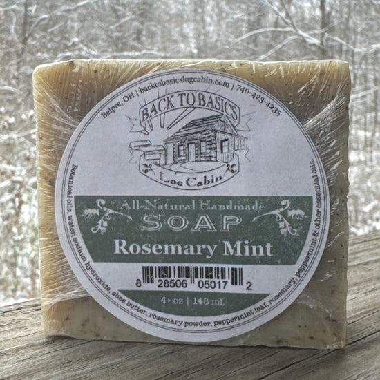 Bar of soap with a label on a wooden surface