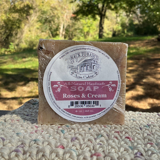 Bar of soap with a label on a textured surface outdoors