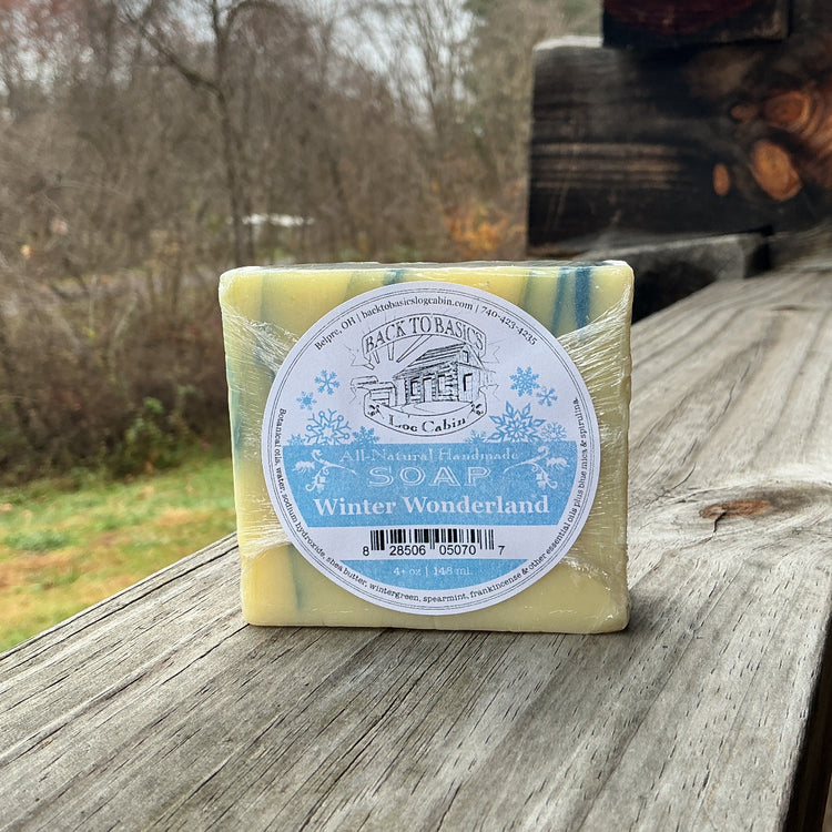 Bar of soap with a label on a wooden surface outdoors